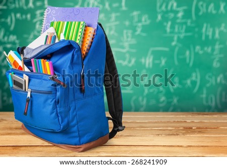 School. Backpack with school supplies including, notebooks, pens, pencils, rulers and glue