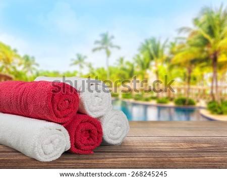 Towel. Five rolled multicoloured bath towels isolated on white