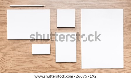 Mockup. Blank stationery set on wood background / a4 paper, business cards, letterheads, booklet, notepad and pen