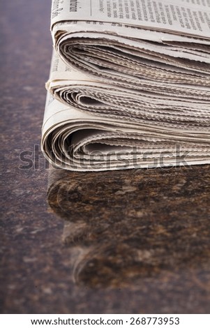 Newspaper. Stacked newspapers