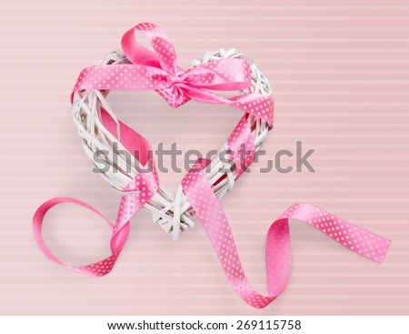 Day. Happy International Women's Day, March 8, celebration greeting message with pink rattan cane heart and stripe ribbon.