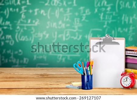Teacher. Books and blackboard, school supplies, back to school