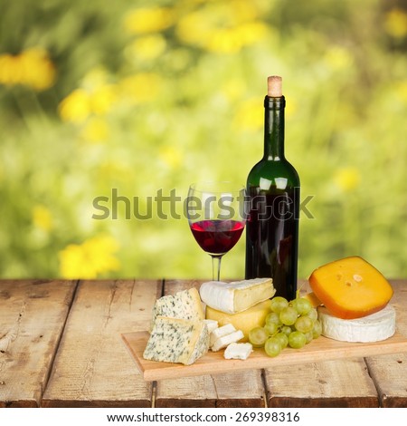 Wine. Red wine, cheese and grapes