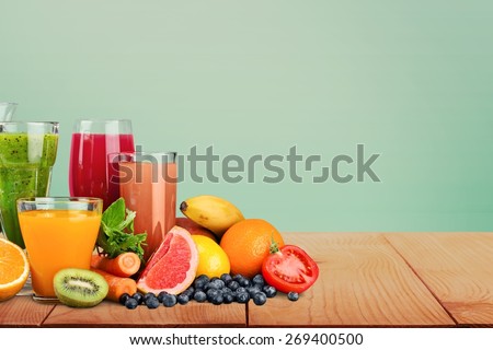 Fruit. Glasses of fruit and vegetable juice with fruits on a white background