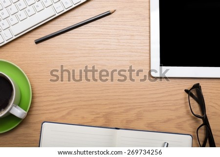 Business. Office supplies, devices, coffee cup and apple on wooden table