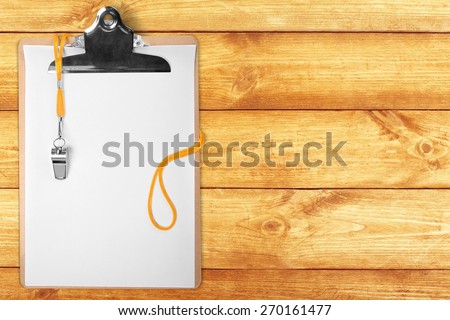 Advice. Blank clipboard with whistle on isolated white background.