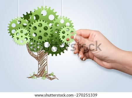 Group. Hand hold green tree of industrial gear, environmental concept