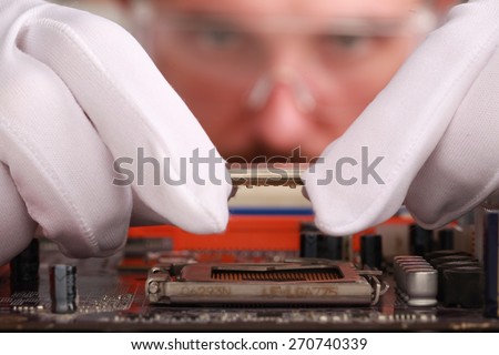 Engineering. Expert engineers examining computer equipment.