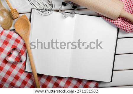 Cook. Cooking concept. Basic baking ingredients and kitchen tools close up