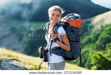 Travel. Hiker portrait. Female hiking woman happy and smiling during hike trek on volcano Teide, Tenerife, Canary Islands. Beautiful young mixed race Asian Chinese / Caucasian sporty model joyful.