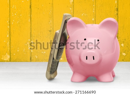 Mobile Phone. Piggy bank on phone