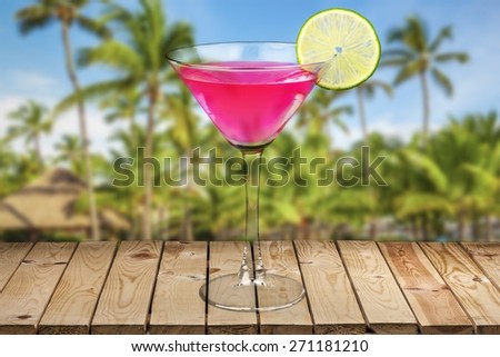 Cocktail. Classic Cosmopolitan Drink with Lime Decoration - Cocktail Glass