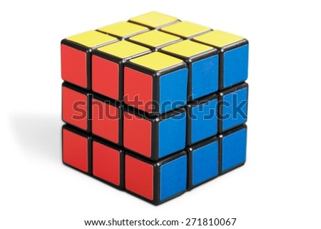 KHERSON, UKRAINE - JULY 16, 2014: Background. Rubik\'s cube on a white background. Rubik\'s Cube invented by a Hungarian architect Erno Rubik in 1974.