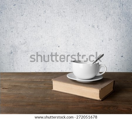 Tea. Cup of coffee and book on wooden table