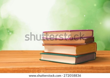 Summer. Old vintage books over beautiful bokeh background