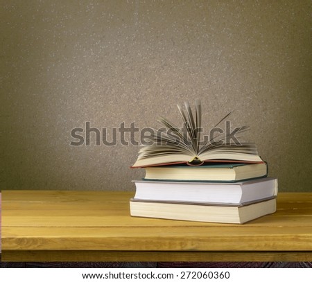 Book. Vintage old books on wooden deck table and grunge background