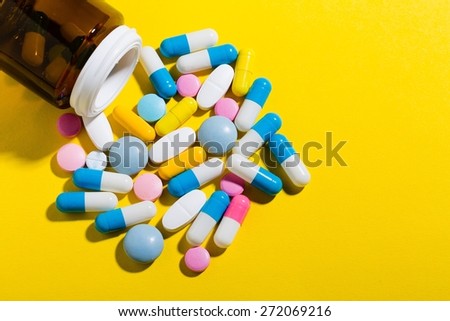 Pill. Colorful pills and tablets on background