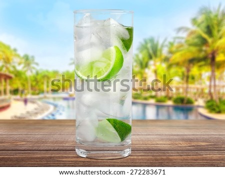 Vodka. Cocktail with ice and lime slice isolated on white background