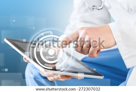 User. Close-shot of male hands holding a tablet in hands