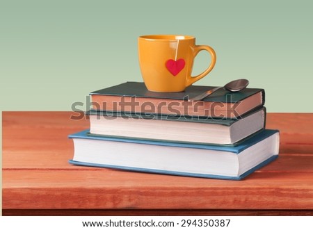 Tea, book, cup.