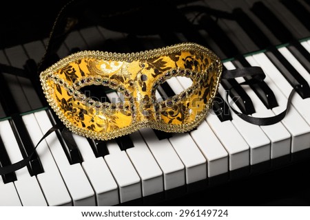 Piano, opera mask, music.