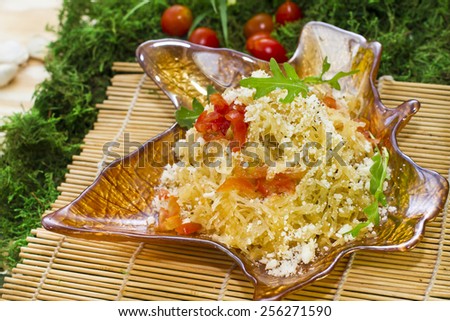 Vegetarian spaghetti squash with parmesan and arugula