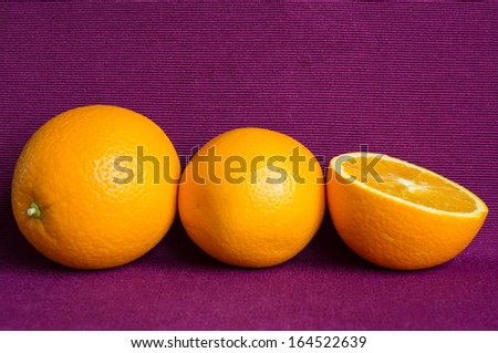 Oranges on a violet background