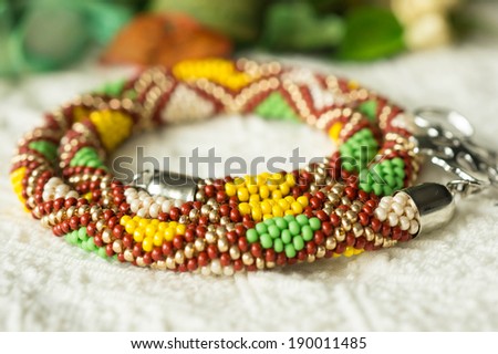 Necklace from beads with a geometrical pattern