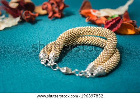 Bracelet of gold color from beads