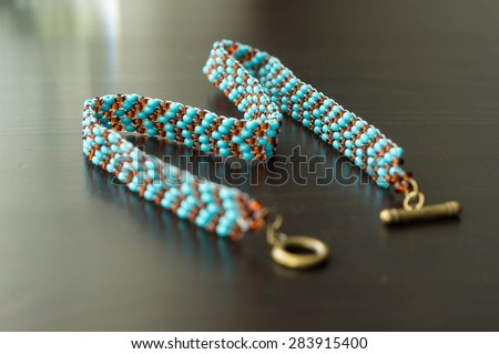 Wattled necklace from beads of turquoise and brown color