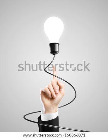 Idea bulb over pointing up hand of a businessman