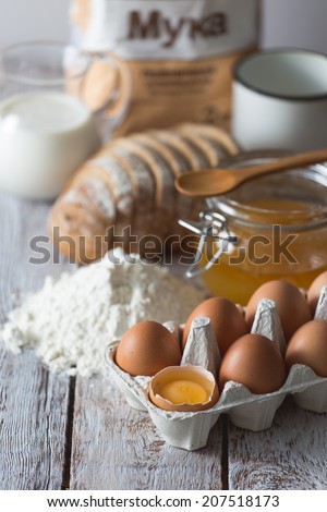 Ingredients for cooking, eggs, honey, bread, flour and milk
