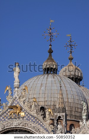 A close-up of the domes of the famous Saint Mark's Basilica on Saint Mark's Square in Venice, Italy.