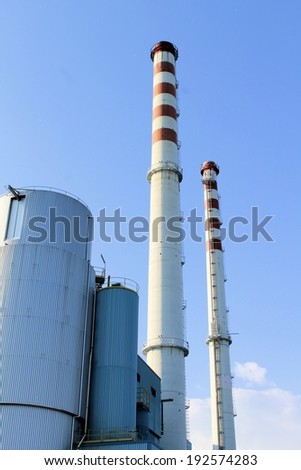 outside of the factory with smokestack in north Italy