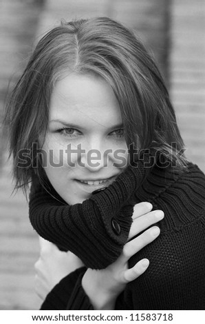 Beautiful woman in black polo neck sweater