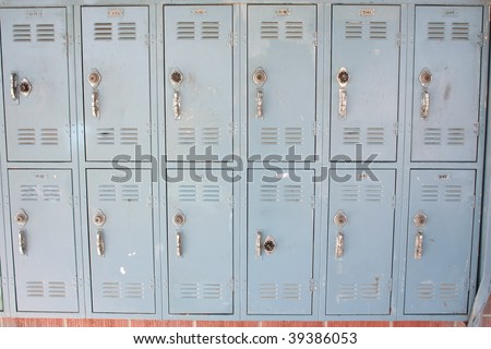 A row of school lockers in desparate need of repaire