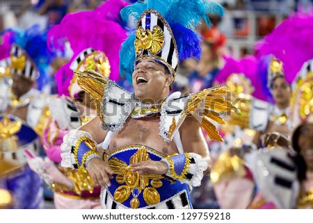 RIO DE JANEIRO - FEBRUARY 11: A man in costume singing and dancing on carnival at Sambodromo in Rio de Janeiro February 11, 2013, Brazil. The Rio Carnival is biggest carnival in world.