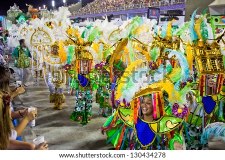 RIO DE JANEIRO - FEBRUARY 10: A womans and man in costume dancing and singing on carnival at Sambodromo in Rio de Janeiro February 10, 2013, Brazil. The Rio Carnival is biggest carnival in world.
