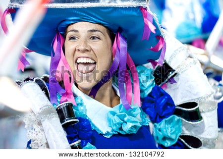 RIO DE JANEIRO - FEBRUARY 11: A woman in costume dancing and singing on carnival at Sambodromo in Rio de Janeiro February 11, 2013, Brazil. The Rio Carnival is biggest carnival in world.