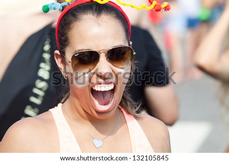 RIO DE JANEIRO - FEBRUARY 11: A women  in costume having fun on the free people\'s carnival in Rio de Janeiro February 11, 2013, Brazil. Av. Vieira Souto along Ipanema beach