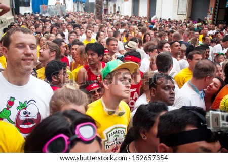 Bunol, Spain - August 28: The crowd awaiting the start of the Battle of tomatoes on Tomatina festival in Bunol, August 28, 2013 in Spine