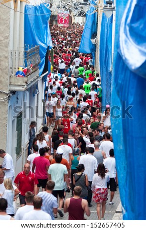 Bunol, Spain - August 28: The crowd awaiting the start of the Battle of tomatoes on Tomatina festival in Bunol, August 28, 2013 in Spain