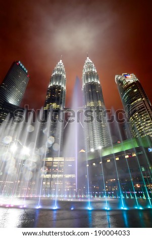 KUALA LUMPUR, MALAYSIA - JANUARY 9: Petronas Twin Towers at day on January 9, 2014 in Kuala Lumpur. Petronas Twin Towers were the tallest buildings (452 m) in the world from 1998 to 2004