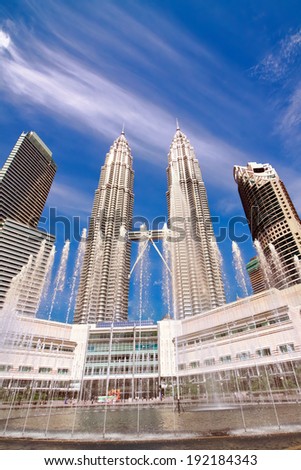 KUALA LUMPUR, MALAYSIA - JANUARY 11: Petronas Twin Towers at day on January 11, 2014 in Kuala Lumpur. Petronas Twin Towers were the tallest buildings (452 m) in the world from 1998 to 2004