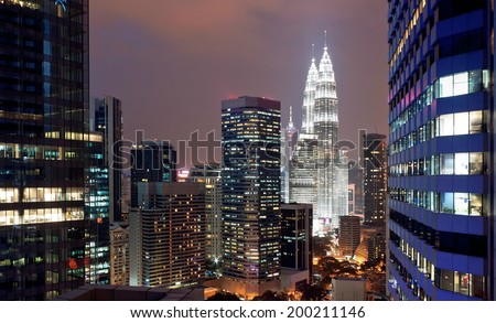 KUALA LUMPUR, MALAYSIA - JANUARY 15: Petronas Twin Towers at day on January 15, 2014 in Kuala Lumpur. Petronas Twin Towers were the tallest buildings (452 m) in the world from 1998 to 2004