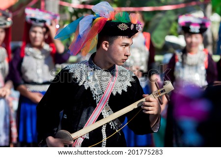 LISU, THAILAND - FEBRUARY 7: Young man in national costumes during Spring Festival (Chinese New Year) in village of Lisu, province of Mae Hong Son, Thailand, February 7, 2014