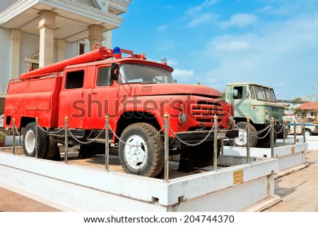 VIENTIANE, LAOS - FEBRUARY 19: Civilian and military vehicles supplied by Soviet Union in form of aid about National History Museum, Vientiane, Laos, February 19, 2014. Fire truck ZIL