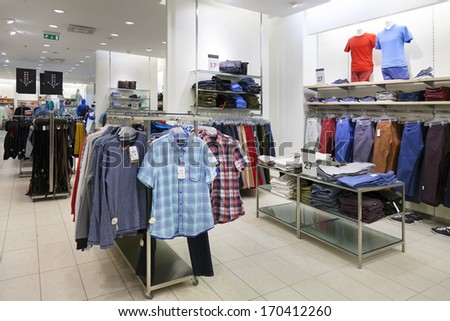 Shop Interior With Mannequin, Dummy. Shelf, Rack And Clothes Hanging In Retail Store.