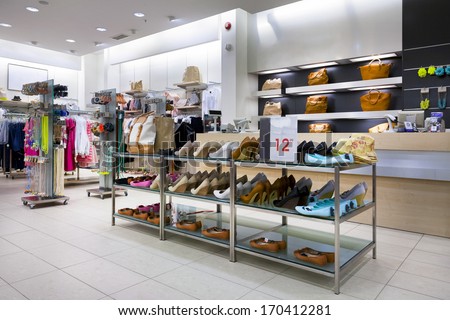 Bags, Shoes And Shelf In Shop Interior. Retail Store Display.