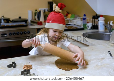 Two Years Old Girl Rolling Pastry. Cooking Gingerbread.